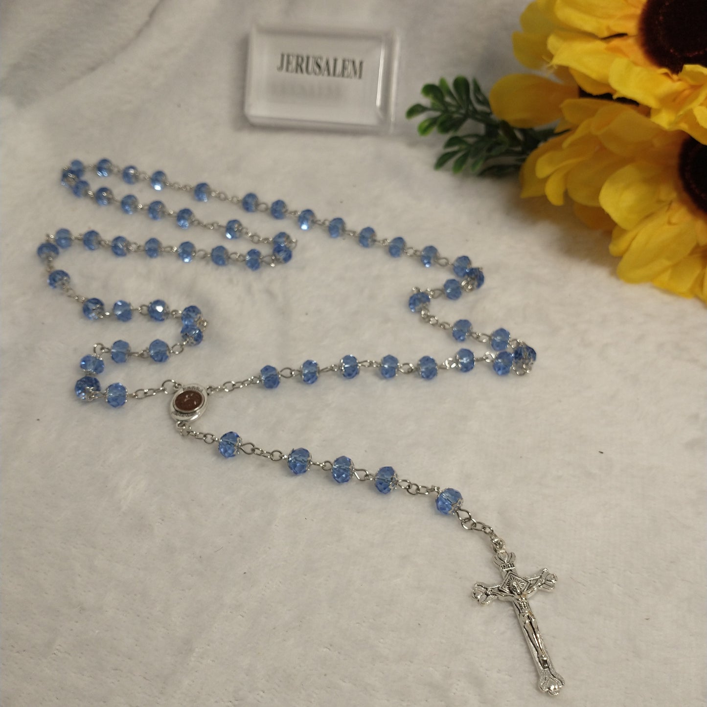 Crystal Blue light rossary very nice color .with Holy soil from Jerusalem .this rossary for prayers .first communion . Baptism