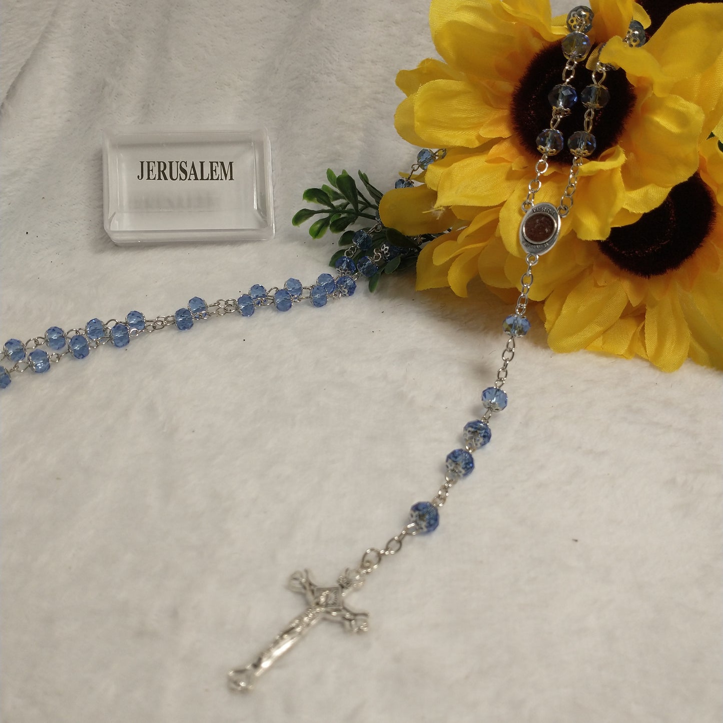 Crystal Blue light rossary very nice color .with Holy soil from Jerusalem .this rossary for prayers .first communion . Baptism