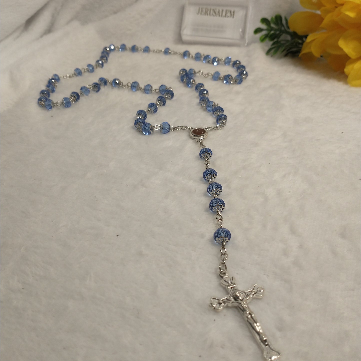 Crystal Blue light rossary very nice color .with Holy soil from Jerusalem .this rossary for prayers .first communion . Baptism