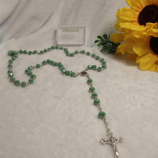 Crystal Dark green rosary so beautiful one .with holy soil from Jerusalem unique color .this rossary for prayers .first Communion . Baptism