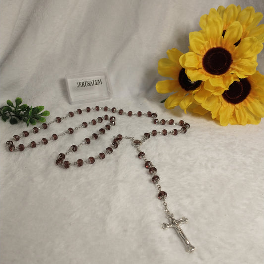 Crystal light brown rossary with Holy soil from Jerusalem .Hand made .very nice Color .this rosary for Prayer s .first Communion . Baptism.