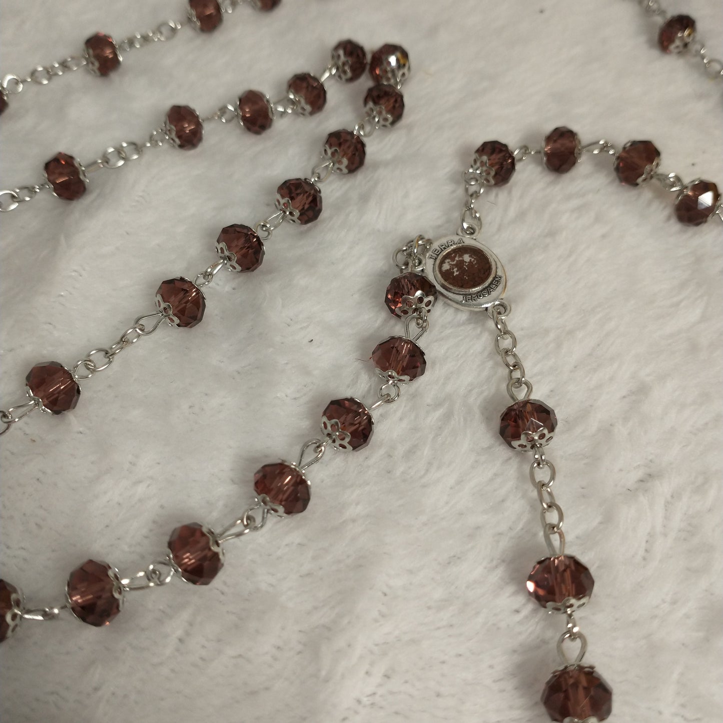 Crystal light brown rossary with Holy soil from Jerusalem .Hand made .very nice Color .this rosary for Prayer s .first Communion . Baptism.