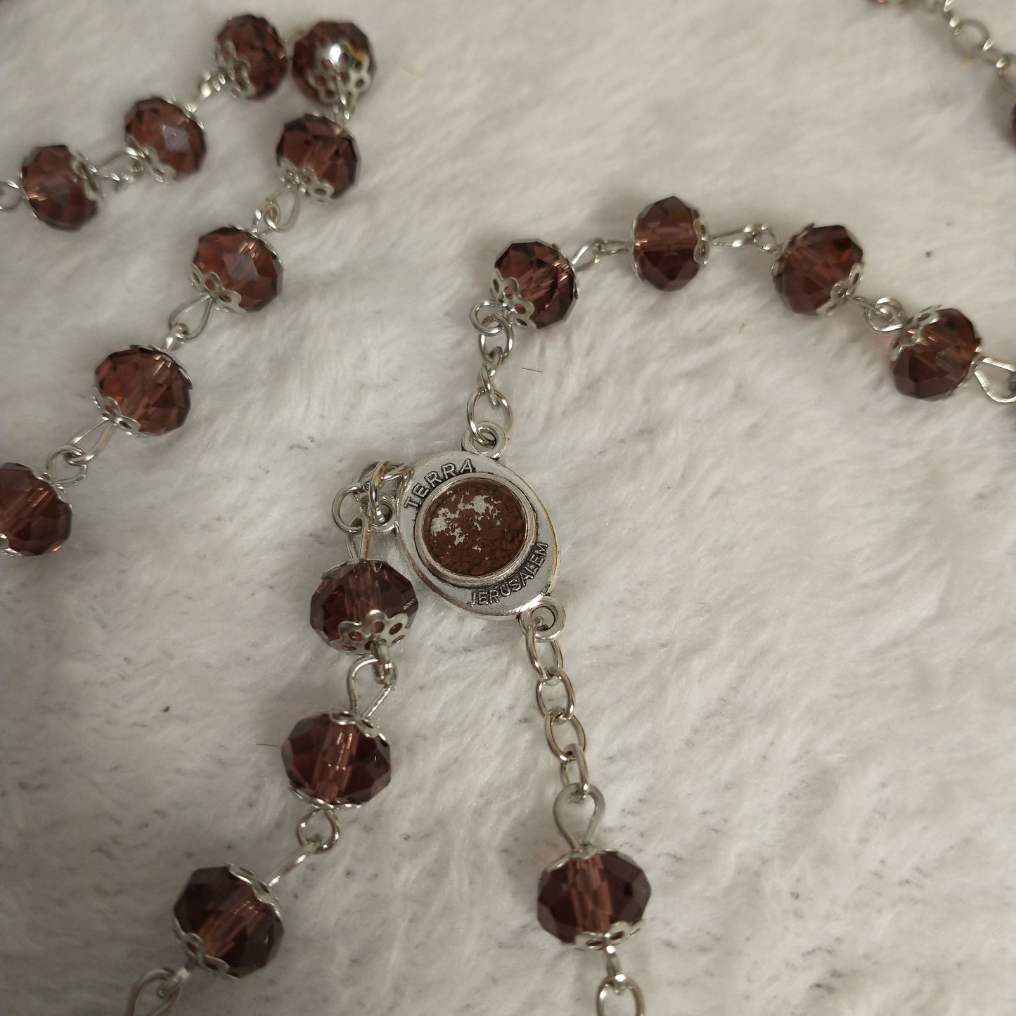 Crystal light brown rossary with Holy soil from Jerusalem .Hand made .very nice Color .this rosary for Prayer s .first Communion . Baptism.