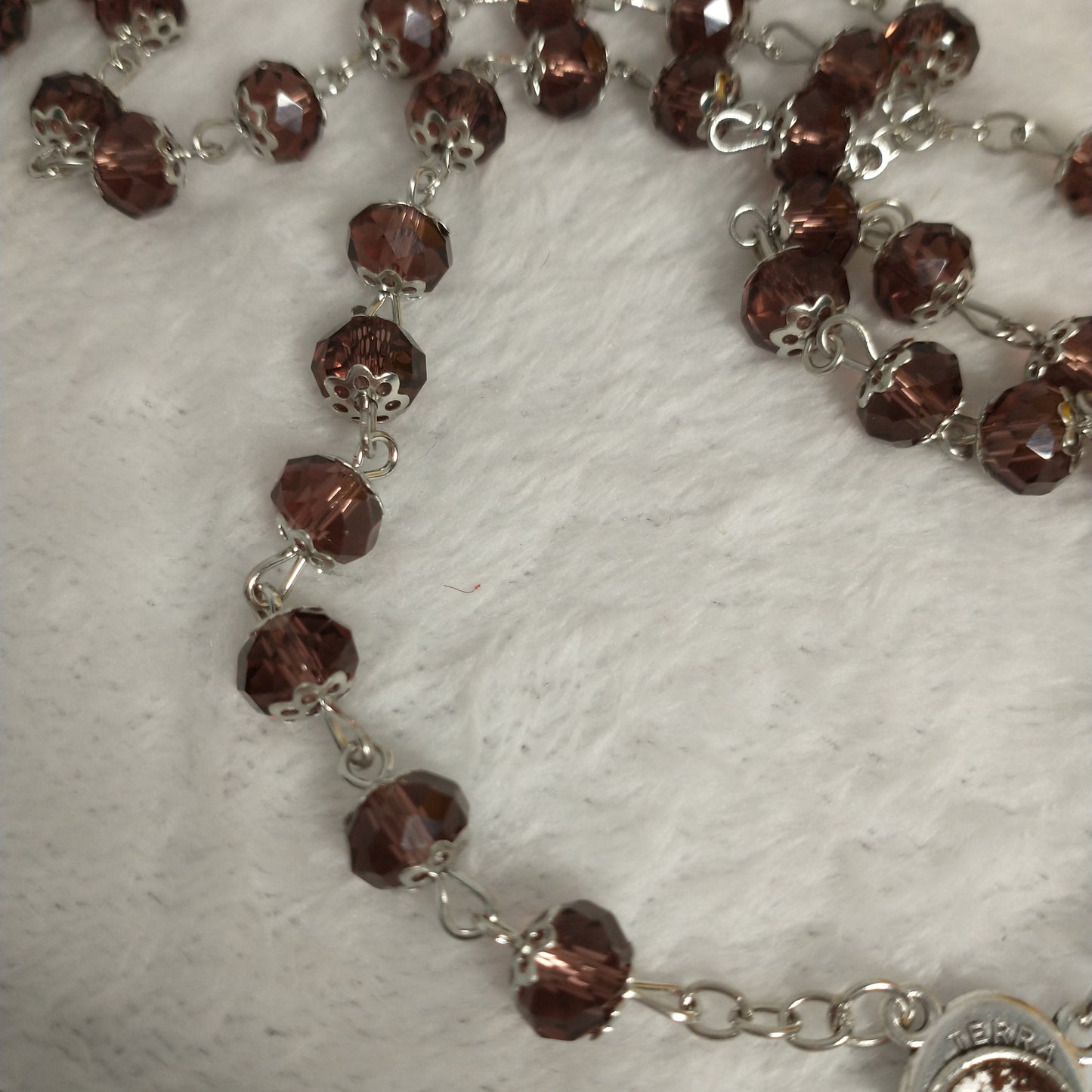 Crystal light brown rossary with Holy soil from Jerusalem .Hand made .very nice Color .this rosary for Prayer s .first Communion . Baptism.