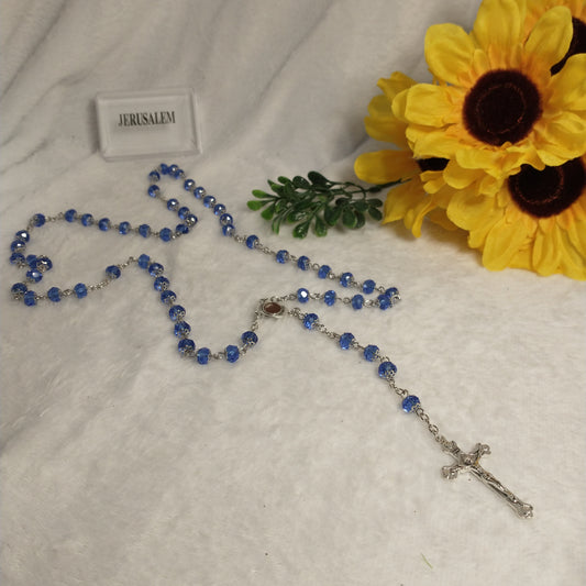 Crystal light blue color with Holy soil from Jerusalem .hand made .this rosary for prayers .first Communion . Baptism