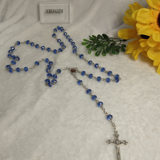 Crystal light blue color with Holy soil from Jerusalem .hand made .this rosary for prayers .first Communion . Baptism