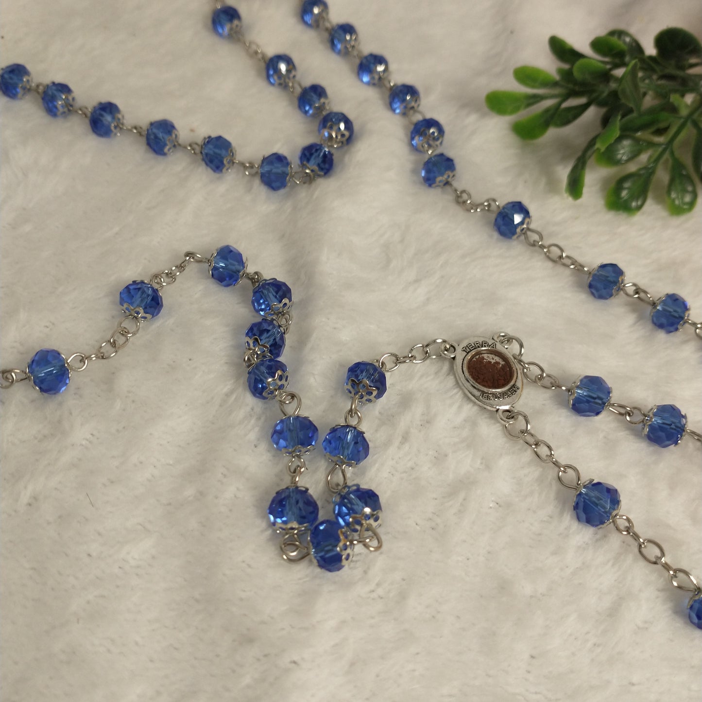 Crystal light blue color with Holy soil from Jerusalem .hand made .this rosary for prayers .first Communion . Baptism