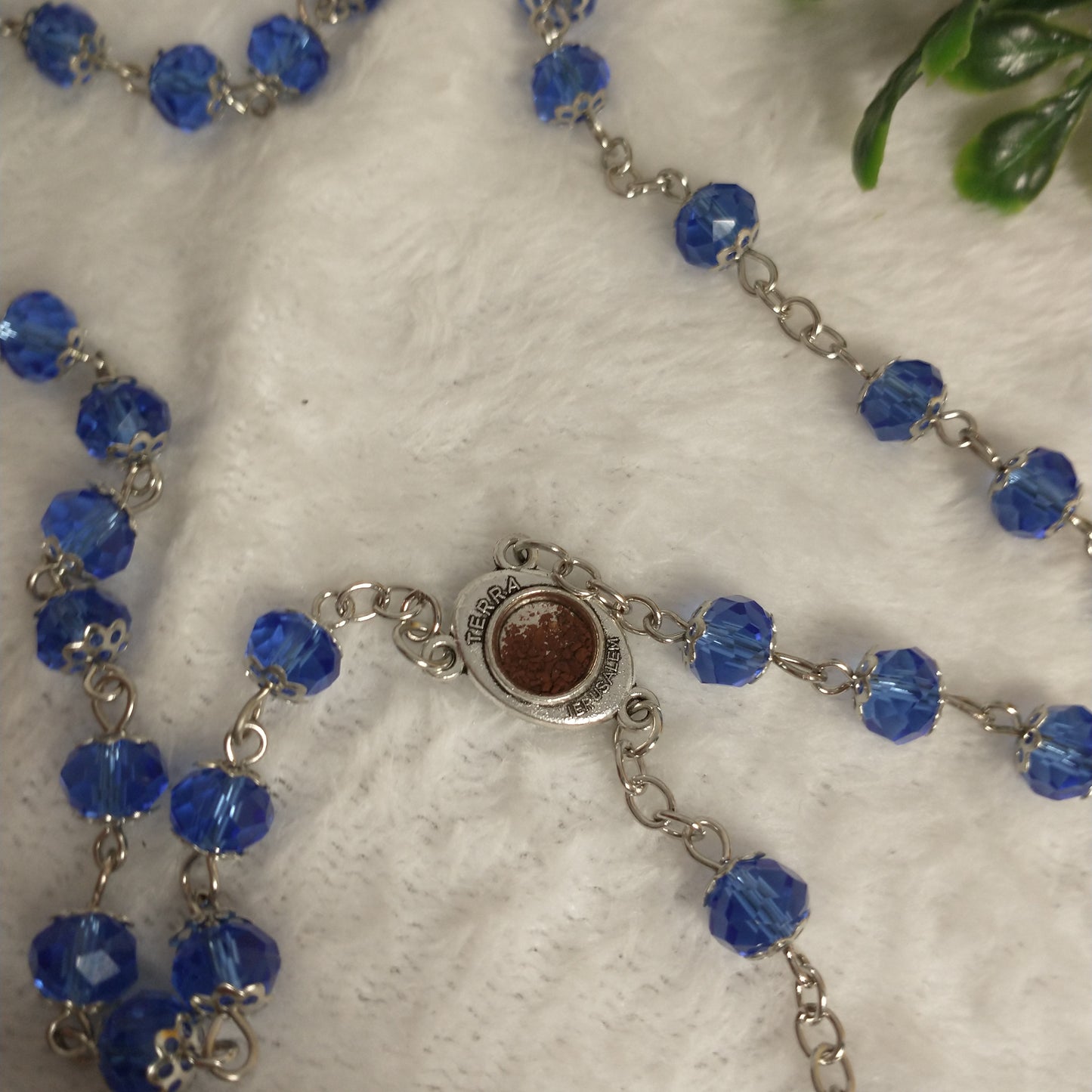 Crystal light blue color with Holy soil from Jerusalem .hand made .this rosary for prayers .first Communion . Baptism