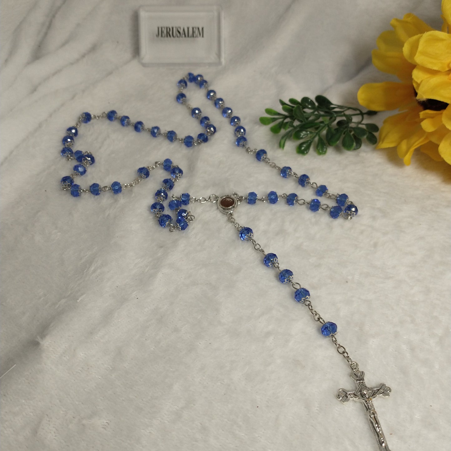 Crystal light blue color with Holy soil from Jerusalem .hand made .this rosary for prayers .first Communion . Baptism