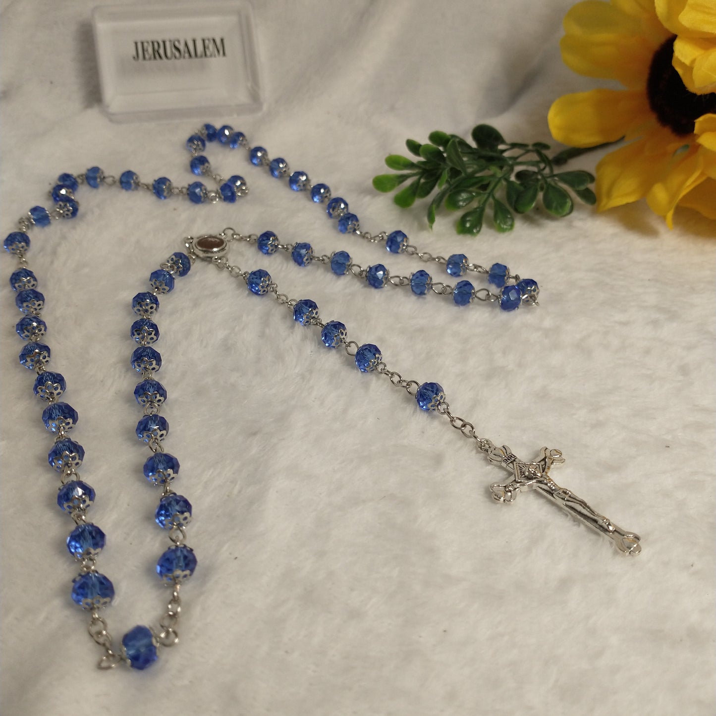 Crystal light blue color with Holy soil from Jerusalem .hand made .this rosary for prayers .first Communion . Baptism