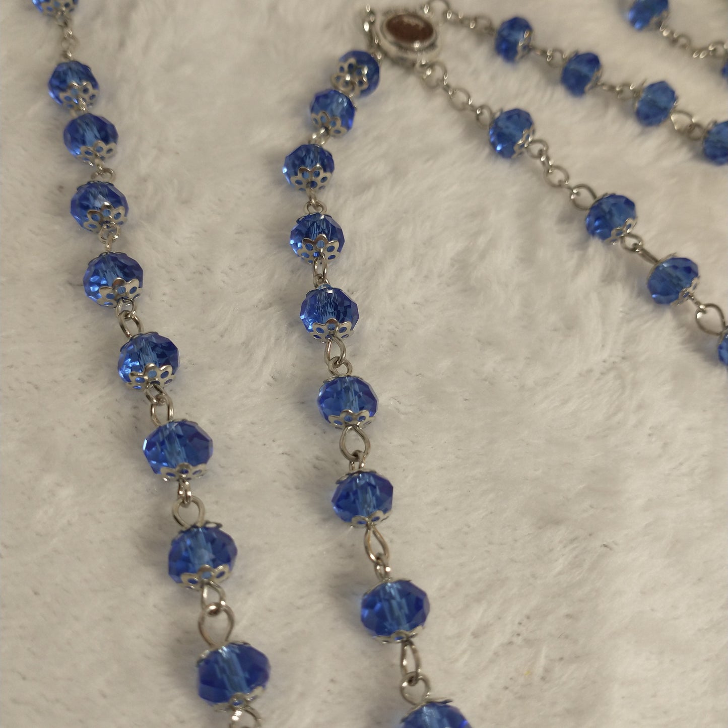 Crystal light blue color with Holy soil from Jerusalem .hand made .this rosary for prayers .first Communion . Baptism