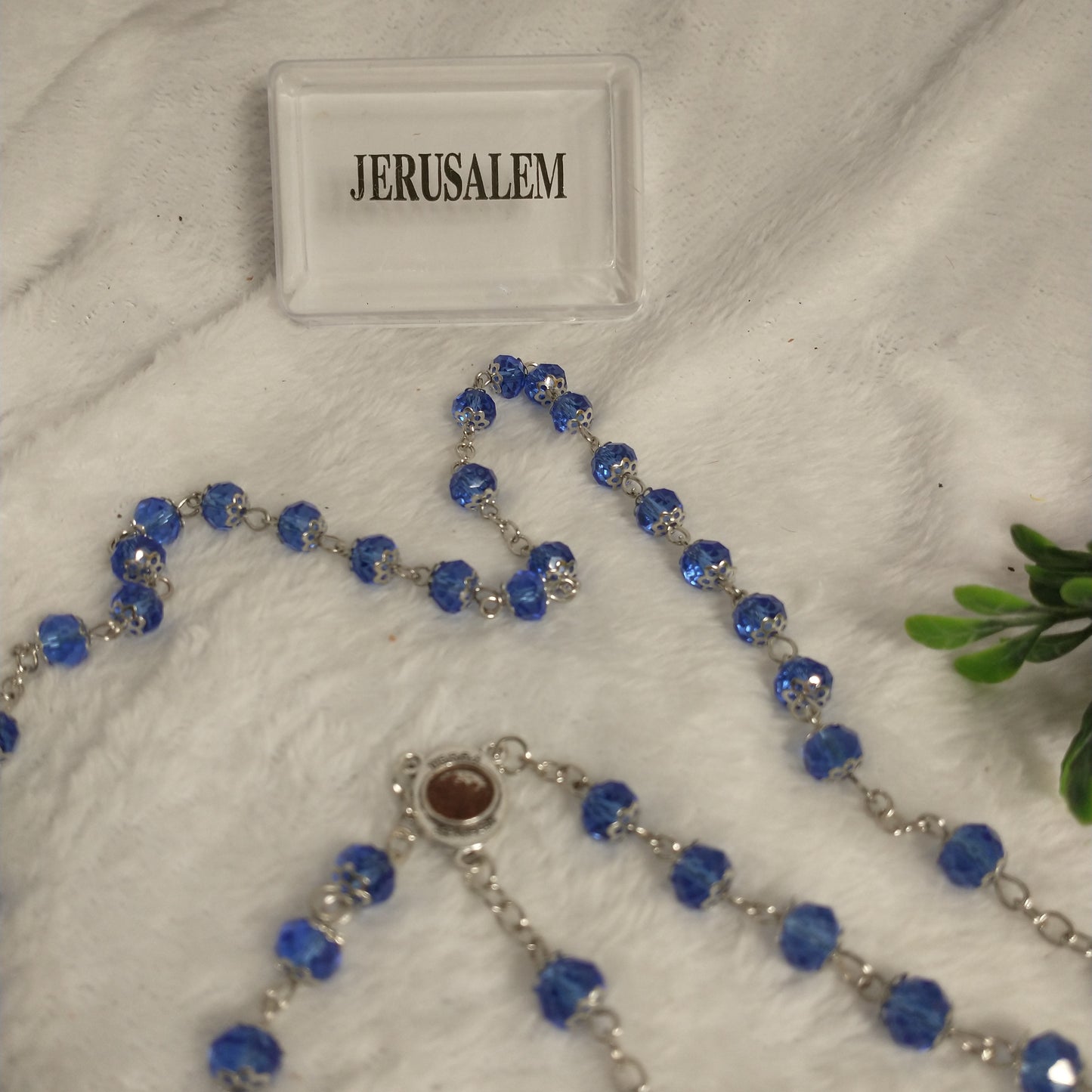 Crystal light blue color with Holy soil from Jerusalem .hand made .this rosary for prayers .first Communion . Baptism