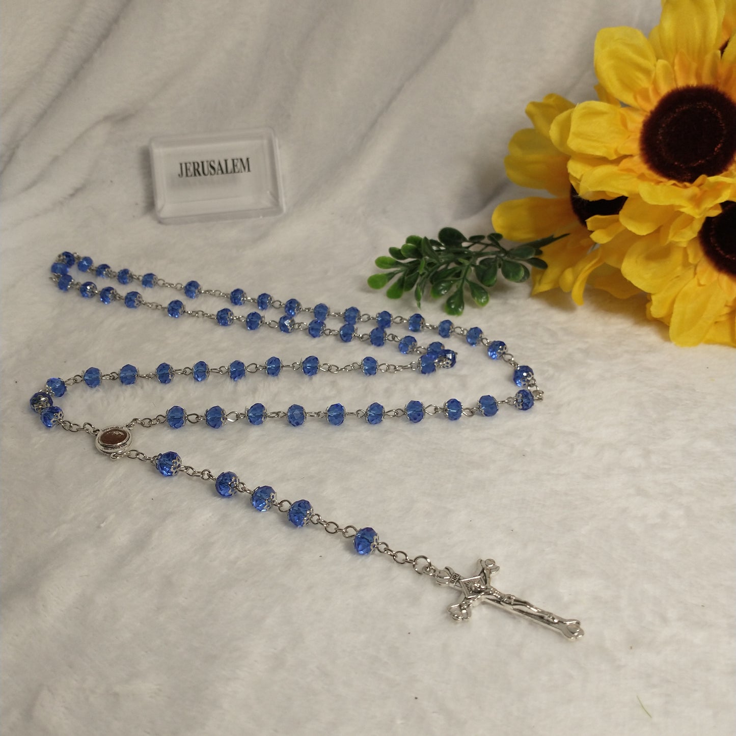 Crystal light blue color with Holy soil from Jerusalem .hand made .this rosary for prayers .first Communion . Baptism